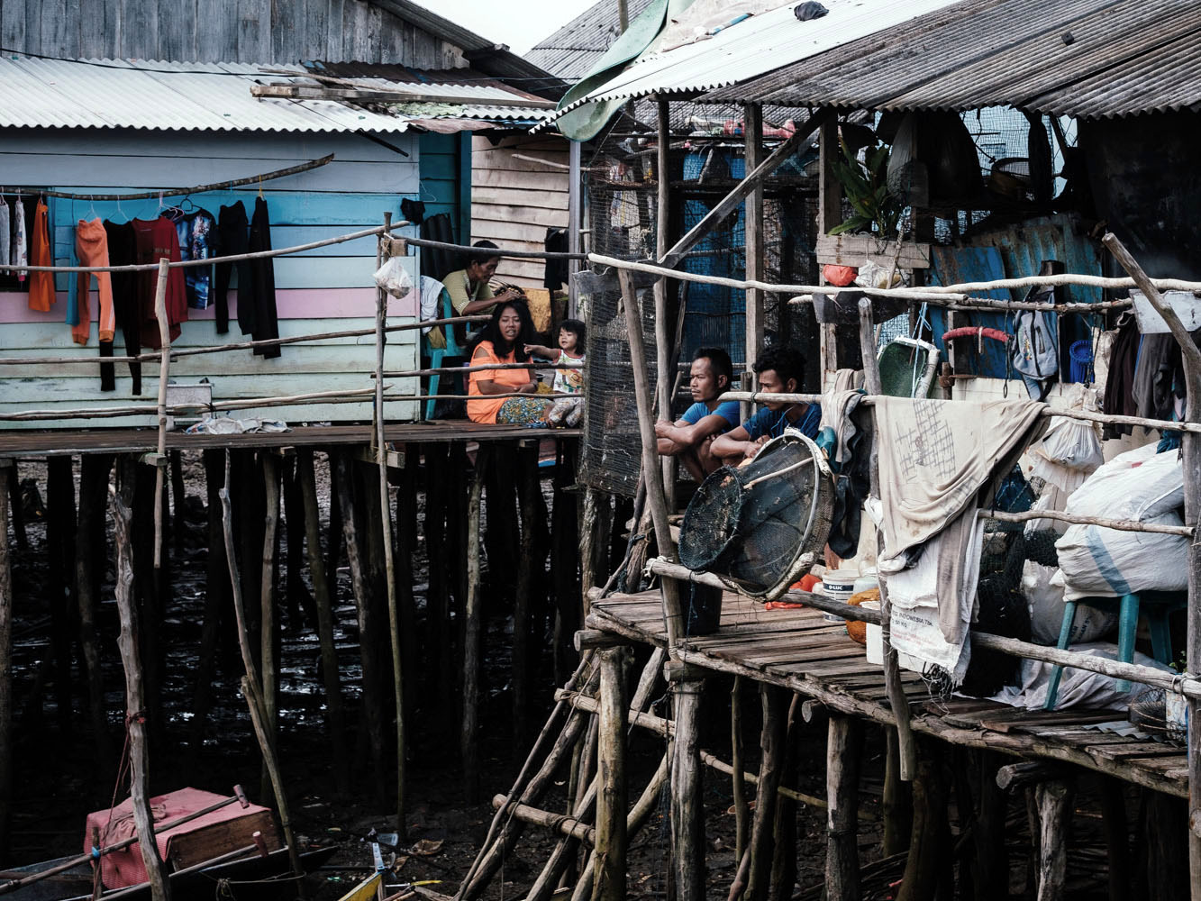 The Orang Laut go about their daily lives at their stilt houses in Tanjung Gundap, Batam, in March 2023. Amid Batam’s rapid economic development, the community has become increasingly marginalized.