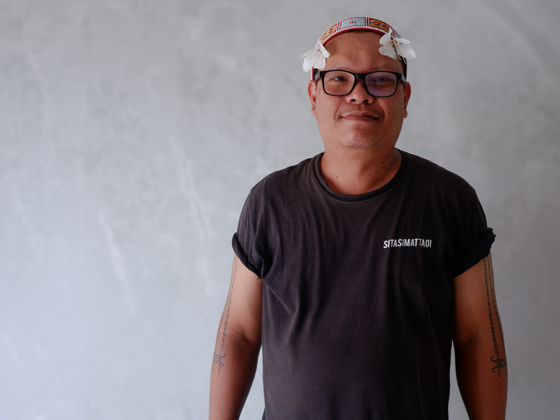 Rus Akbar Saleleubaja, 45, is an editor at MentawaiKita.com. The tattoos on his arms are part of his effort to preserve Mentawai's cultural heritage.