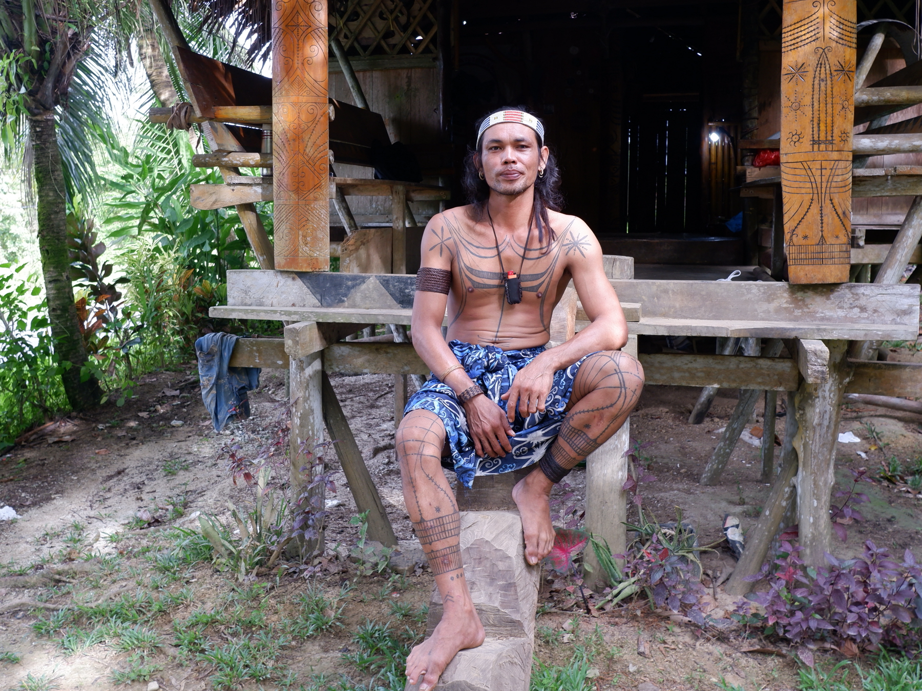 Bajak Letcu, 38, at his tattoo studio in Tuapeijat, North Sipora, Mentawai Islands. Letcu, whose real name is Viator Simanri Sakombatu, is a sipatiti (tattoo artist). He is the first tattoo artist from the younger generation to learn the craft.