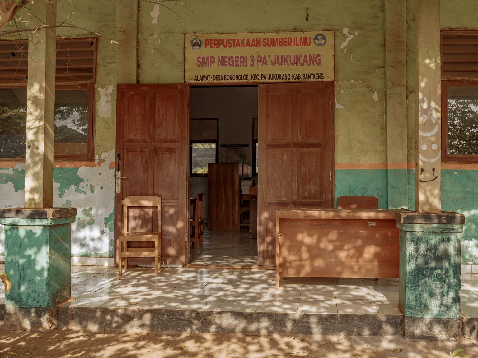 The library at Pa’jukukang State Junior High School (SMPN) 3 sits empty, with its shelves and furniture coated in dust from the nearby industrial park. Enrolment has fallen as parents send their children to larger towns and cities to escape the pollution.