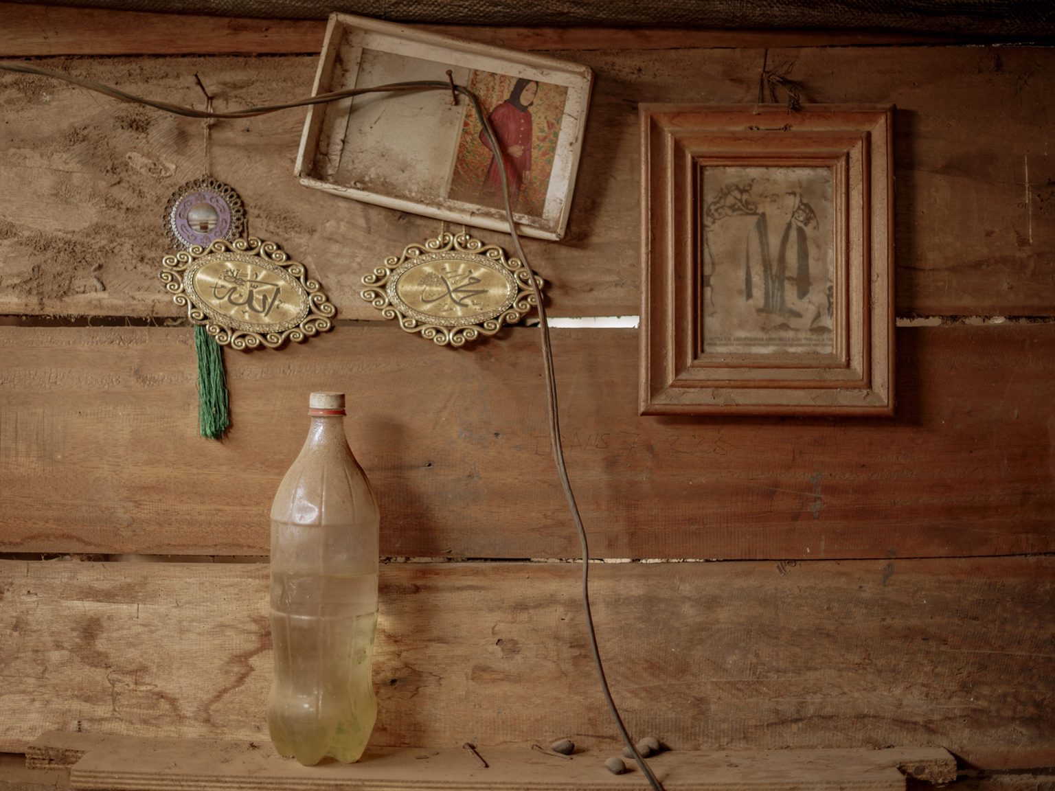 A wall decoration in Ambo Enre’s house, where dust coats nearly every corner, drifting in from two nickel smelters operating day and night.