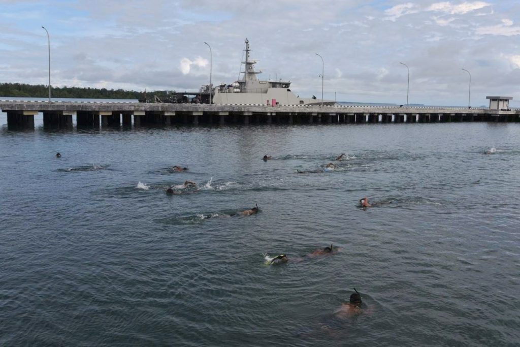 Frogmen from Fleet Command (Koarmada) III conduct a long-distance open-water swim exercise in the waters off Sorong, West Papua, on Aug. 30, 2021.