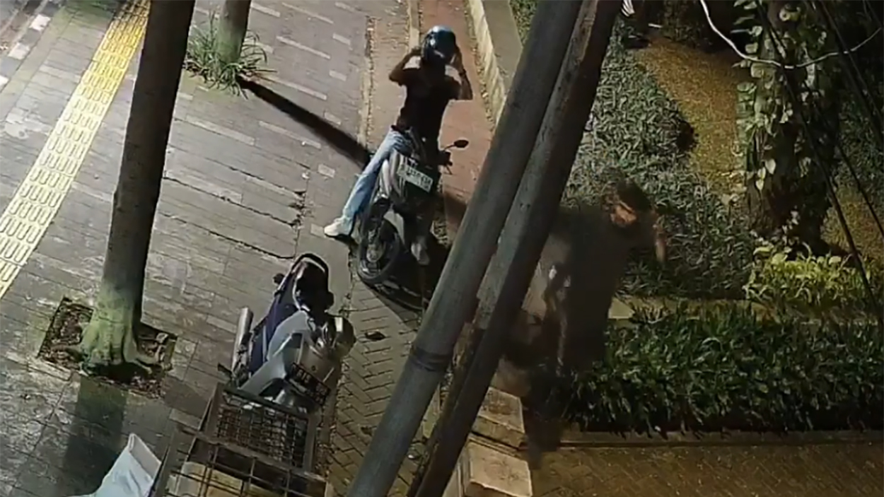 Suspect No. 3 is seen with Suspect No. 4, who appears to have a larger build and a thick mustache.